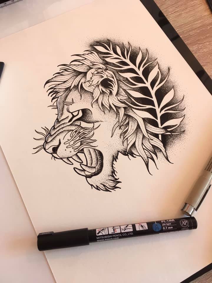 Un dessin déjà réservé qui représente un lion de profil avec du feuillage l'entourant, le tout en travail de points